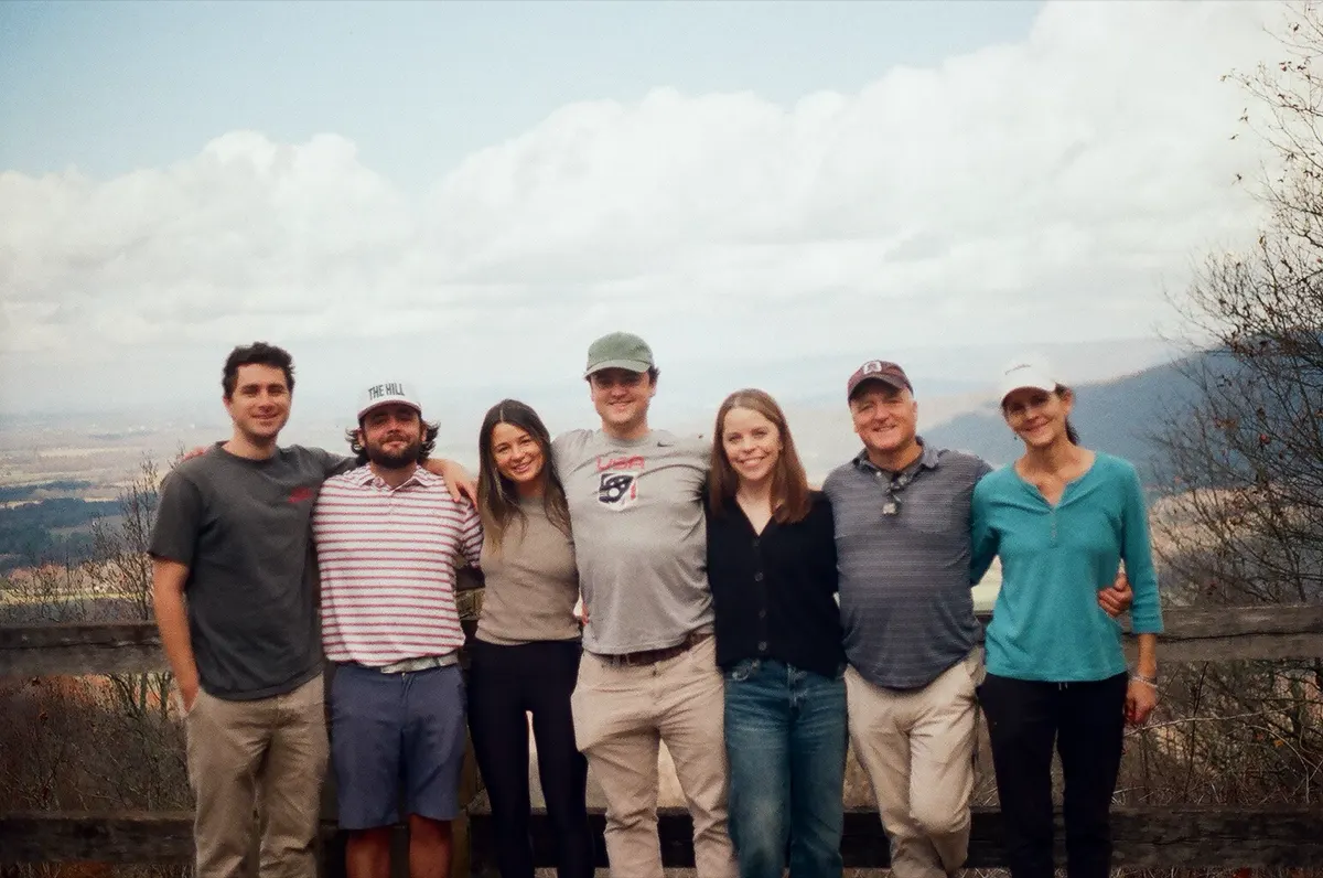 The crew lined up at an overlook, shot on film