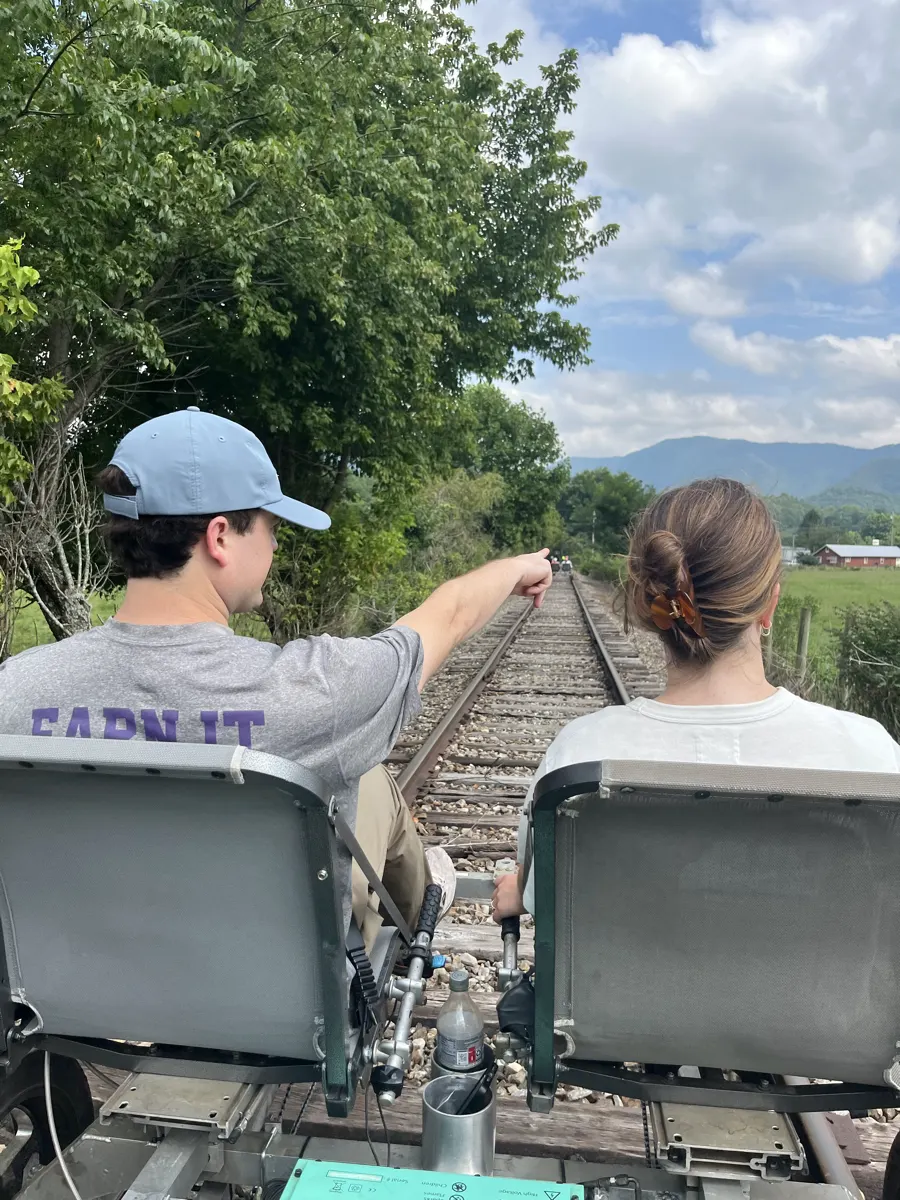 Riding a rail bike down the tracks toward the mountains outside Andrews